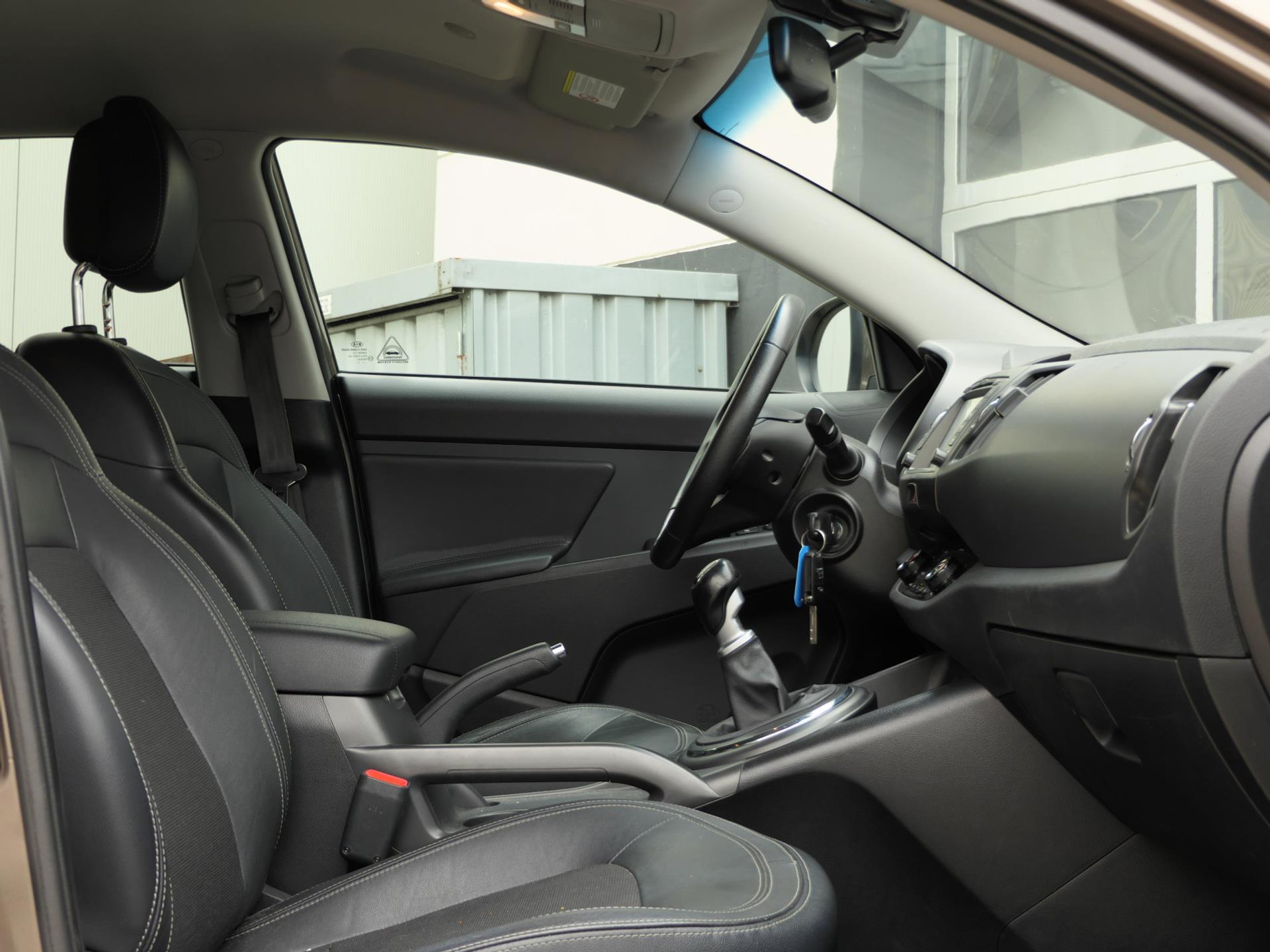 Kia Sportage 1.6 GDI X-ecutive Plus Pack 135PK | Cruise | Half leer/stof | Camera | Bluetooth | 48352153-9.jpg | Autobedrijf van Wierick